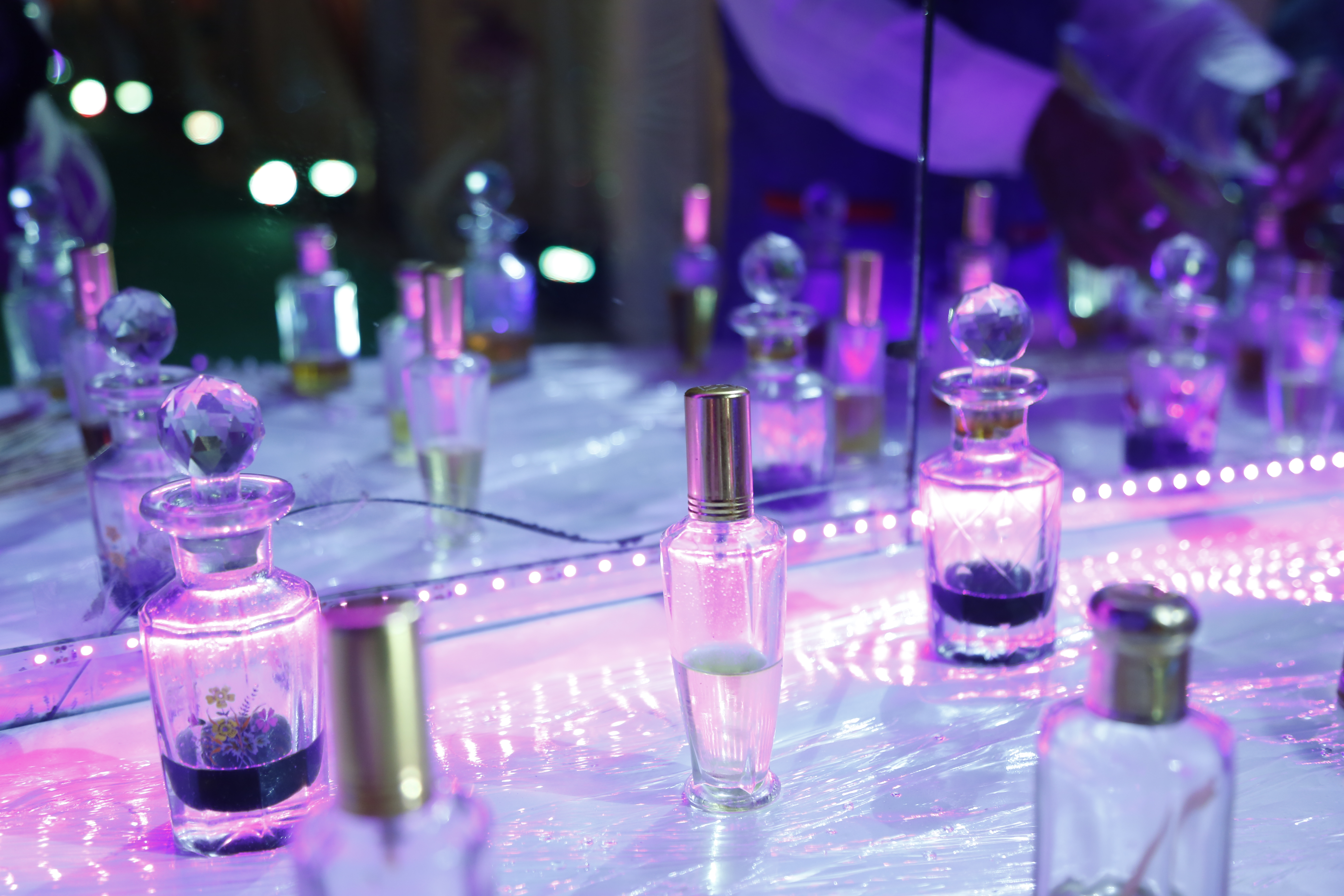 Assorted perfume bottles used for fragrance collection planning